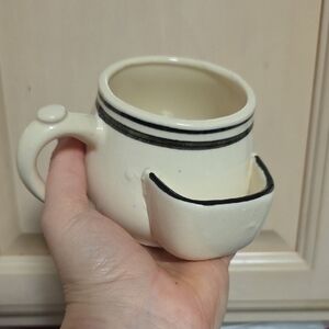 Cream Ceramic Mug with Built-In Snack Holder and Black Trim